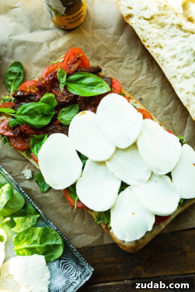 Italian Panini 7 Step-by-step image of adding Italian meats and mozzarella.