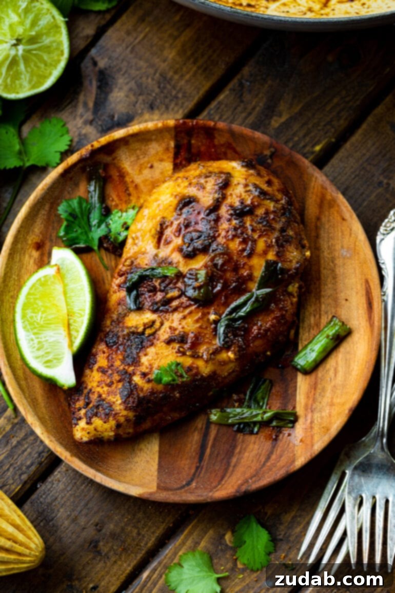 Easy One-Pan 10-Minute Sticky Mexican Chicken 3 Close-up of golden-brown pan-seared chicken breasts coated in a rich, flavorful Mexican spice rub, glistening with juices and ready for the next step.