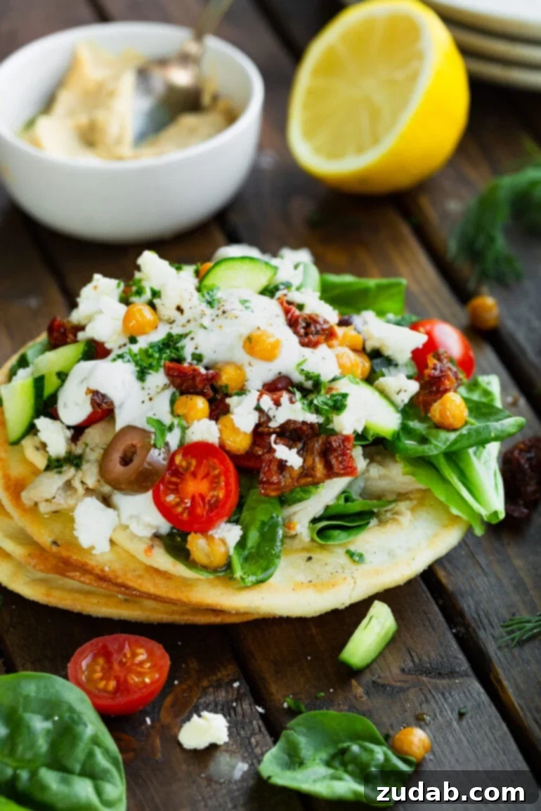 Weekly Meal Plan for October 23-29 7 A vibrant and healthy Greek tostada, generously topped with seasoned ground turkey, fresh diced tomatoes, briny Kalamata olives, crumbled feta cheese, protein-rich chickpeas, and a creamy swirl of cooling tzatziki sauce.