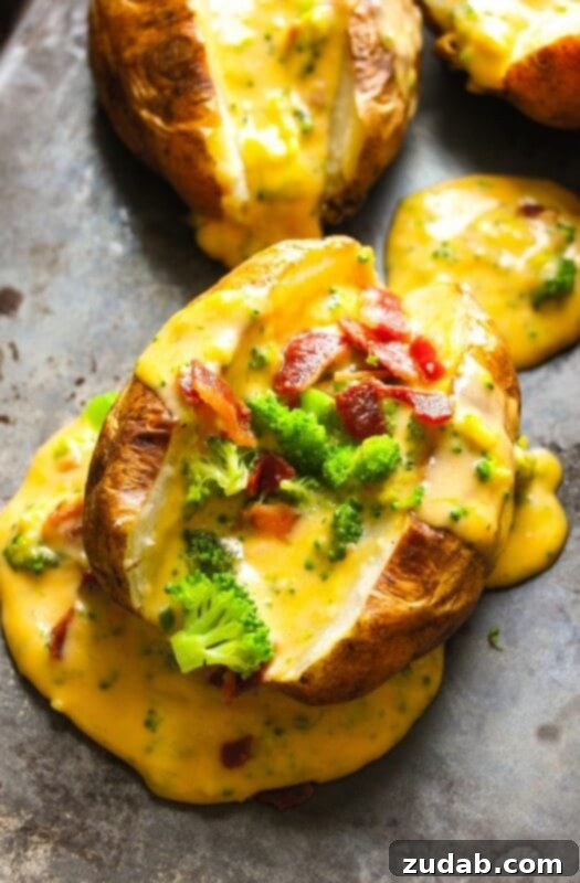 Our Weekly Meal Plan: April 29 - May 5 7 A beautifully prepared loaded baked potato, generously topped with a rich, creamy homemade cheese sauce, savory bacon pieces, and tender broccoli florets, creating an irresistible and hearty meal.