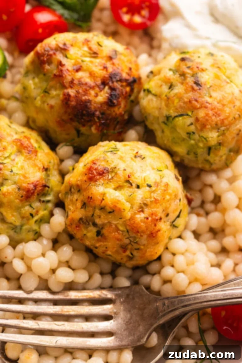 Herb-Infused Greek Chicken Meatballs 6 Greek Chicken Meatballs on pearl couscous