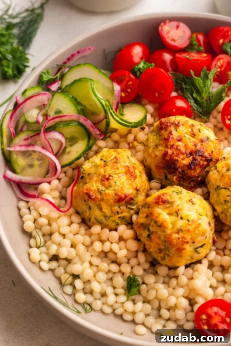 Herb-Infused Greek Chicken Meatballs 7 Greek Chicken Meatballs on couscous with salad