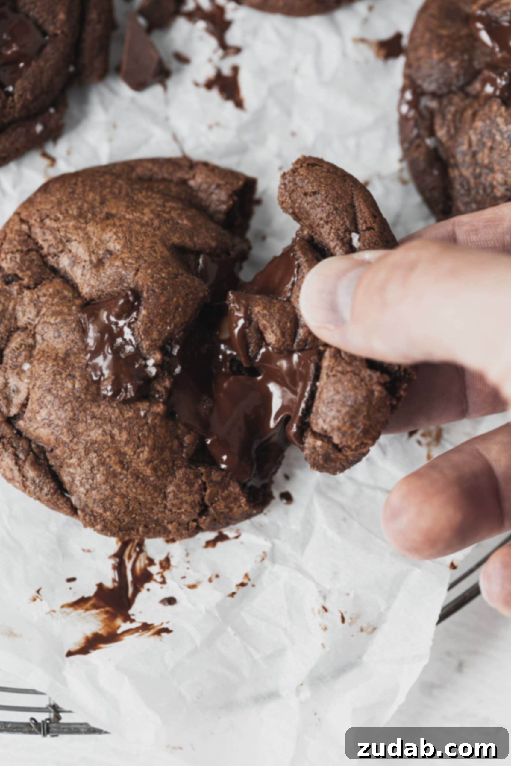 Soft and Chewy Double Chocolate Chip Cookie Breaking Apart a Warm Double Chocolate Chip Cookie