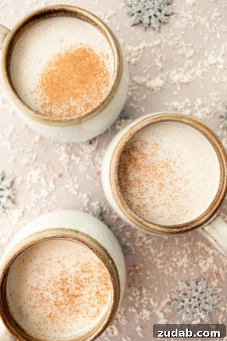 Snowman Soup: A Hug in a Mug for the Holidays 8 Several mugs of warm vanilla milk topped with whipped cream and cinnamon