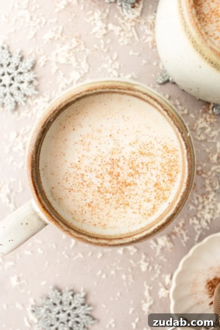Snowman Soup: A Hug in a Mug for the Holidays 10 A vanilla steamer in a mug topped with cinnamon