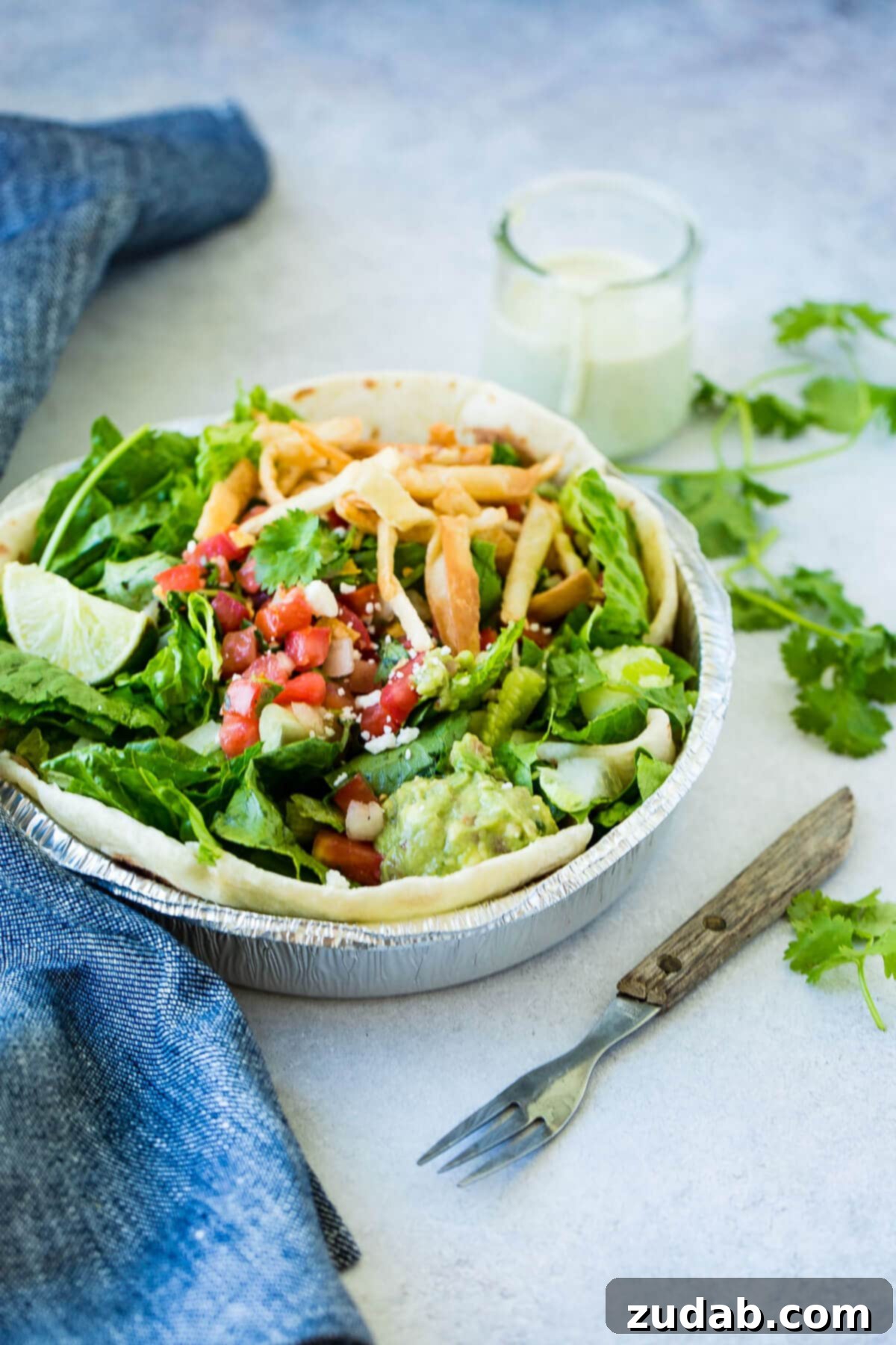 Cafe Rio's Famous Chicken: A Culinary Adventure 7 Cafe Rio chicken salad with pico de gallo and a lime wedge