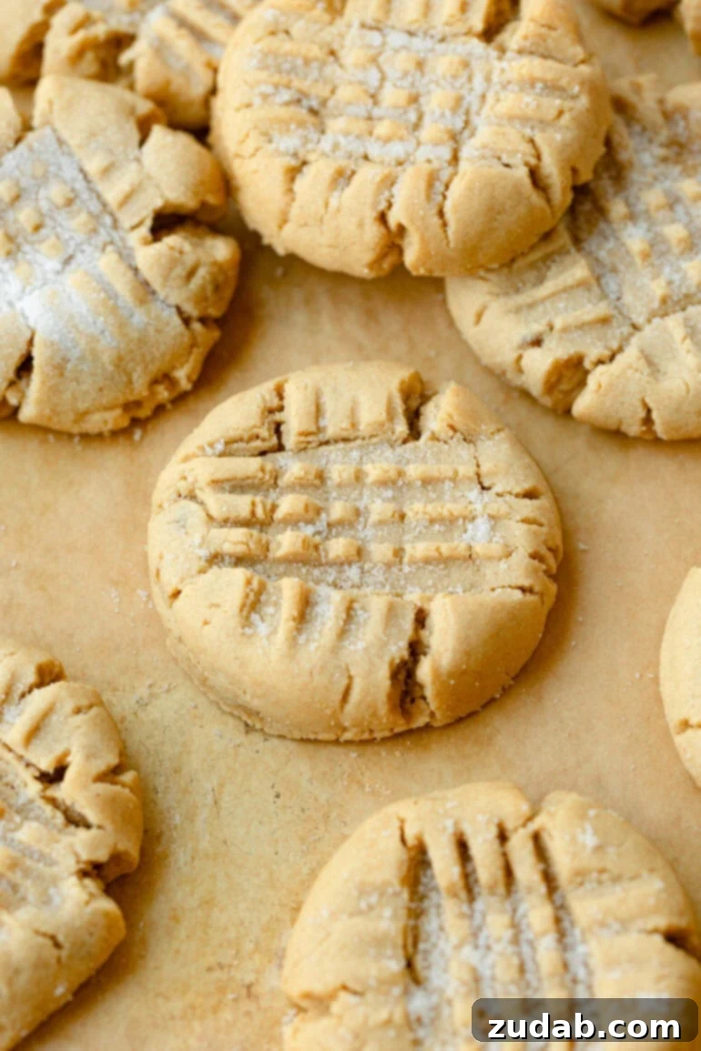 The Ultimate Guide to Perfect Peanut Butter Cookies 8 Peanut Butter Cookies on Parchment Paper