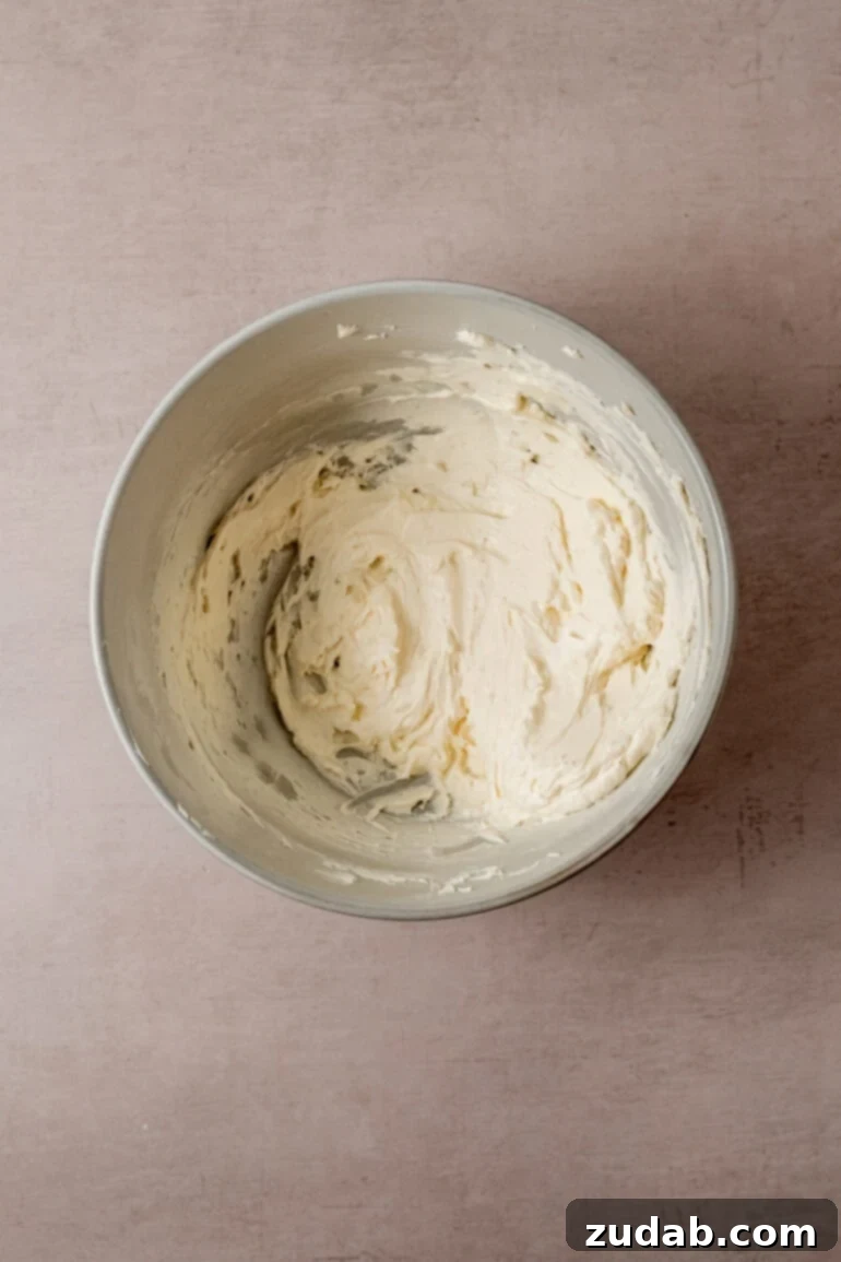 From Box to Bliss: Elevating Simple Chocolate Cake 13 Butter being creamed in a mixer.
