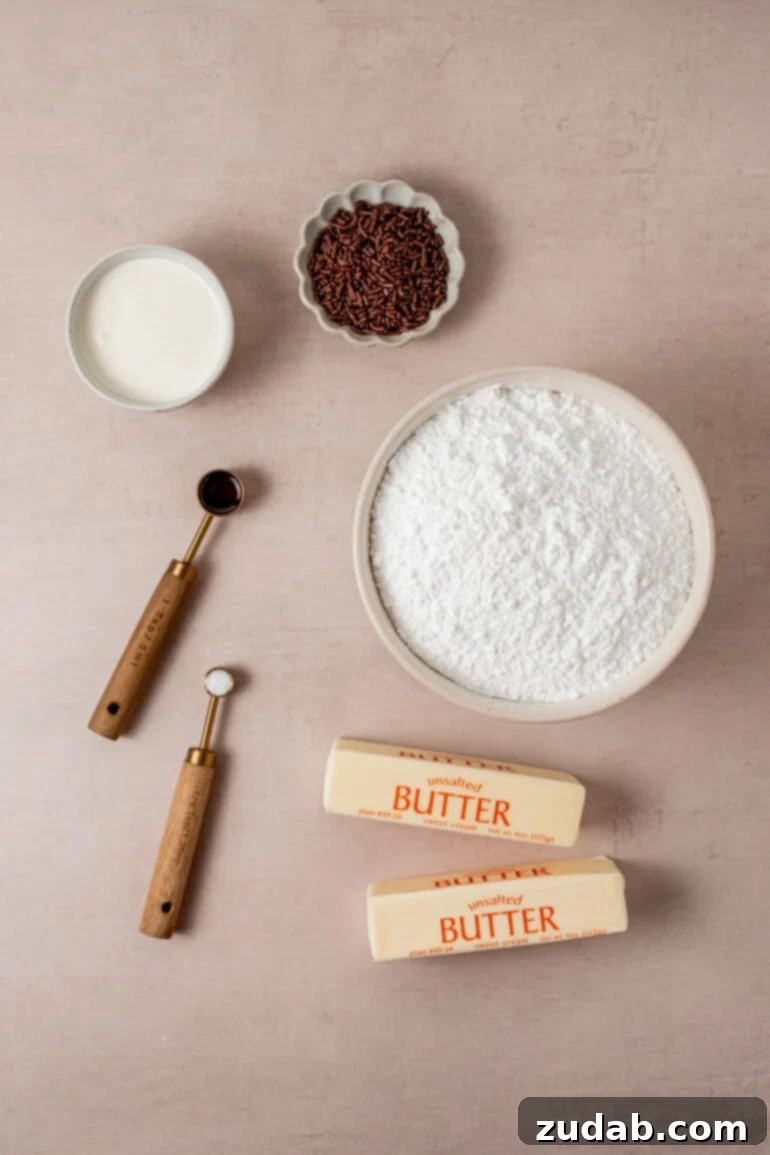 From Box to Bliss: Elevating Simple Chocolate Cake 8 All the ingredients for vanilla buttercream frosting, including sticks of butter, powdered sugar, vanilla, heavy cream, and chocolate sprinkles.