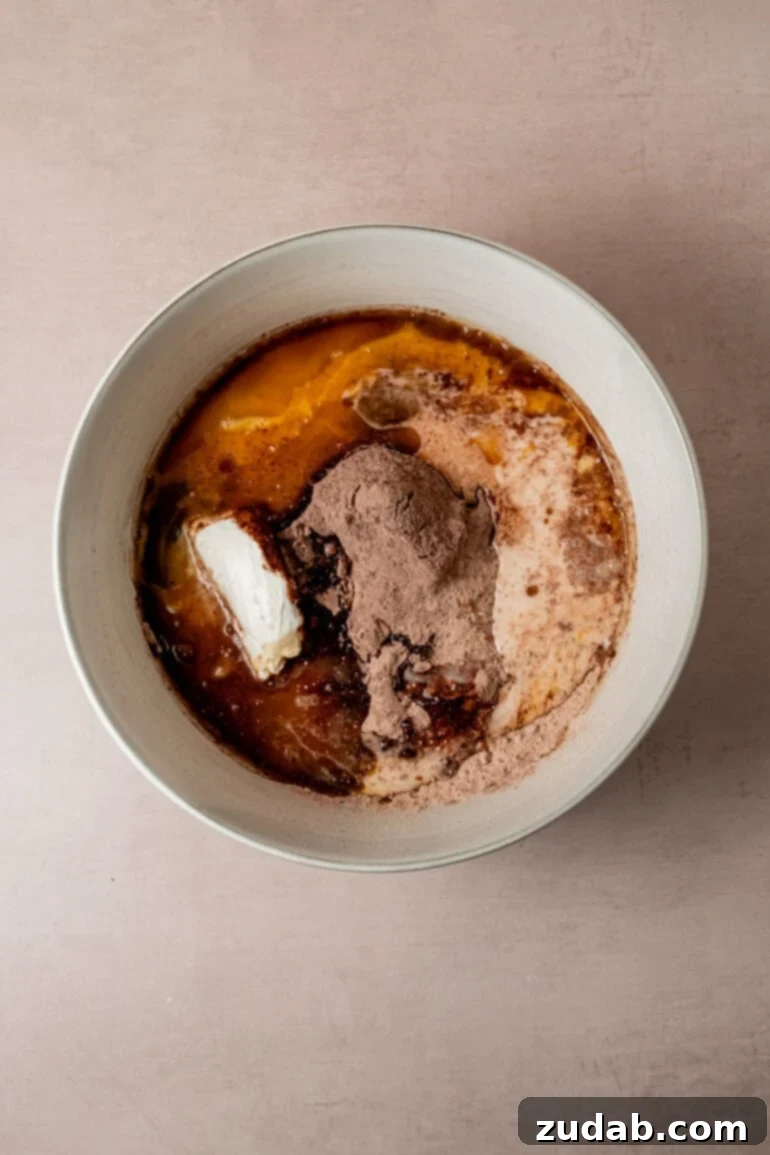 From Box to Bliss: Elevating Simple Chocolate Cake 9 Cake batter being mixed in a bowl.