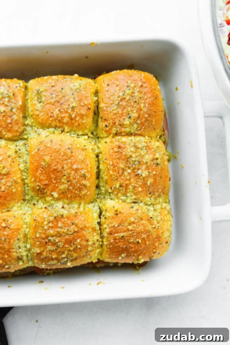 Super Bowl Slider Showdown: An Italian Twist 5 assembling Italian Sliders.