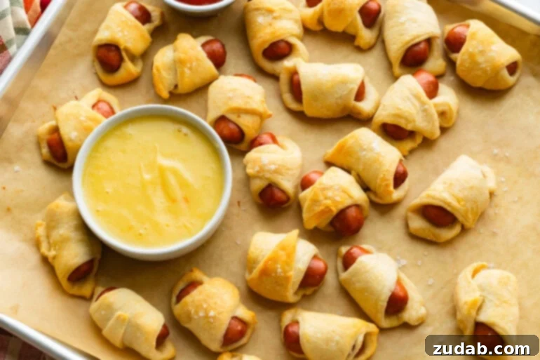 Pigs in a Blanket: A Savory Bite-Sized Delight 4 Baked Lil Smokies with crescent roll and honey mustard