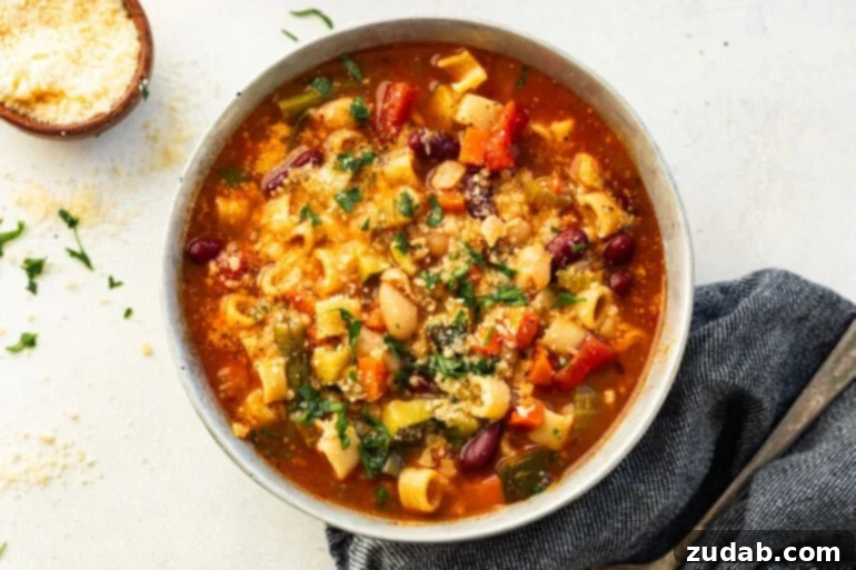 Grandma's Secret Garden Minestrone 2 A vibrant bowl of classic Minestrone soup, showcasing a colorful mix of vegetables in a rich tomato broth.