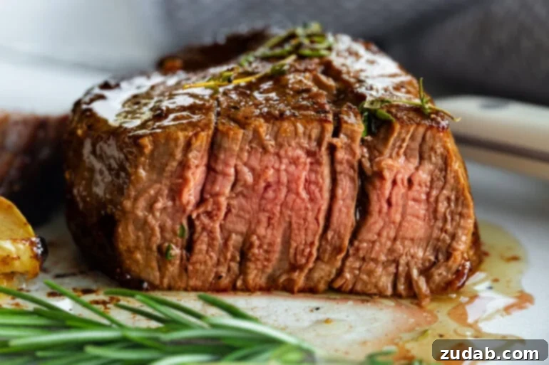 The Ultimate Guide to Filet Mignon: Restaurant-Quality Results at Home 2 Perfectly cooked filet mignon with a pink center and seared exterior