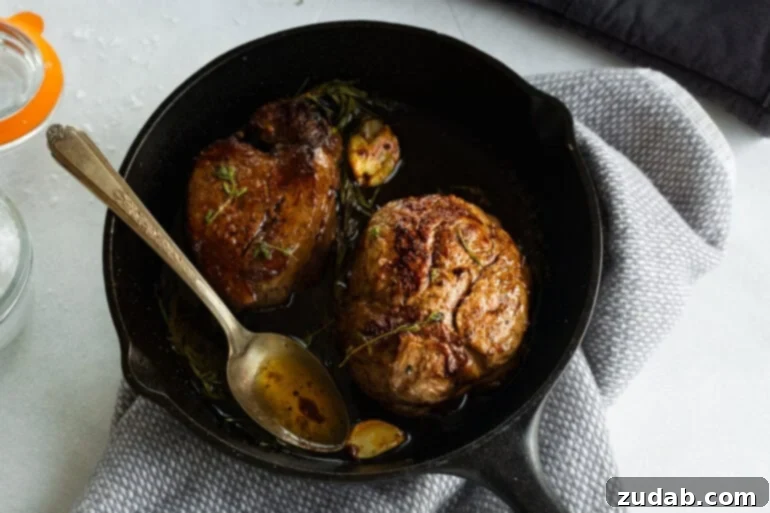 The Ultimate Guide to Filet Mignon: Restaurant-Quality Results at Home 3 Pan-seared filet mignons in a cast iron skillet
