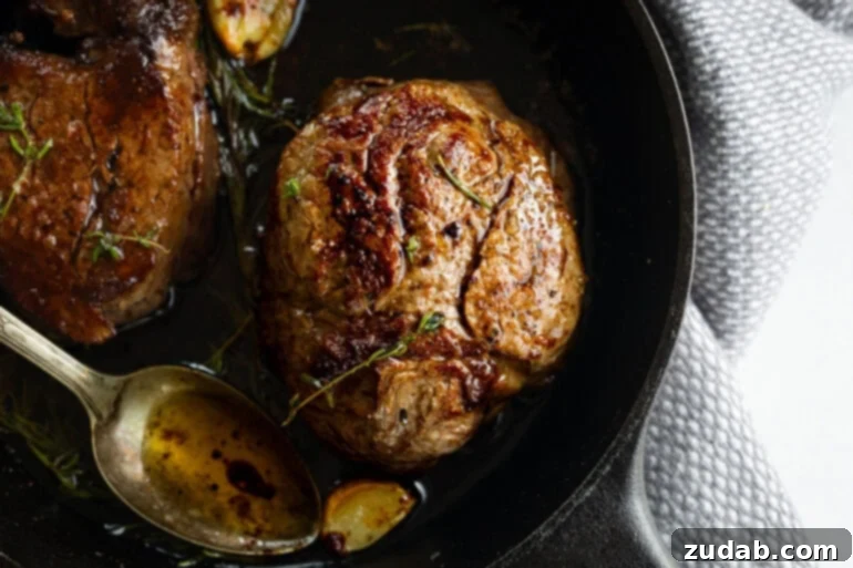 The Ultimate Guide to Filet Mignon: Restaurant-Quality Results at Home 4 Perfectly seared filet mignon basted with butter and herbs
