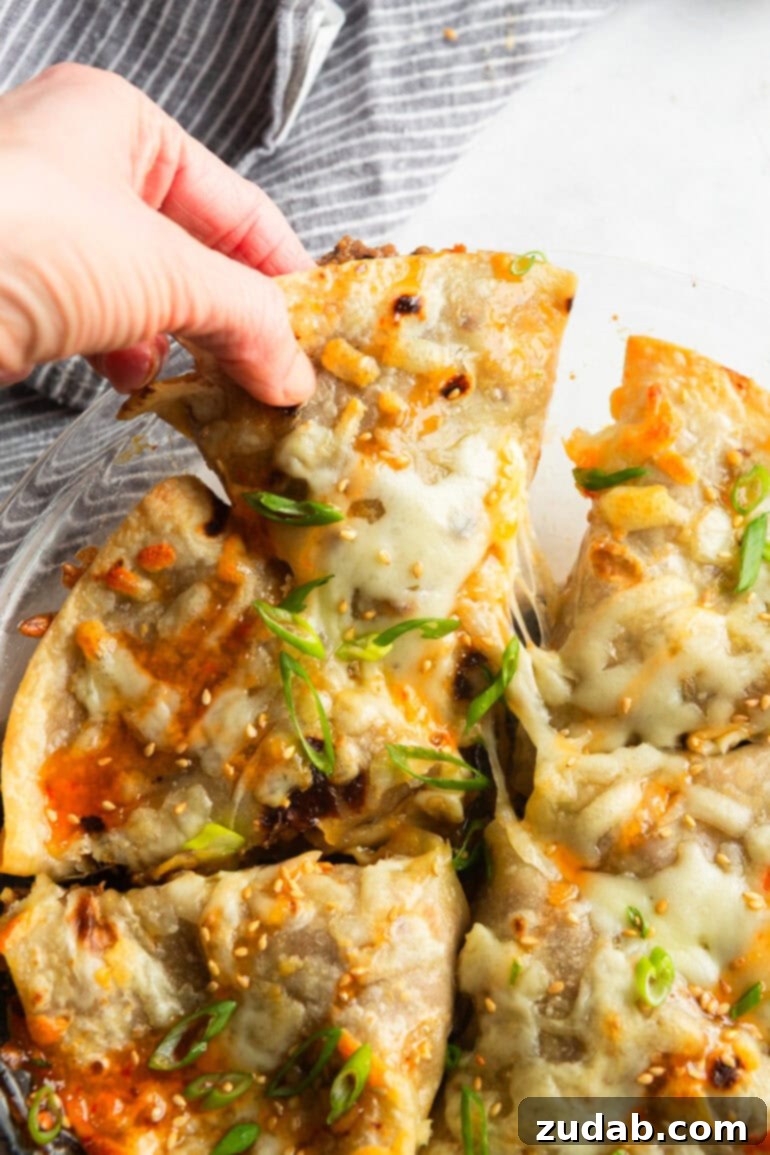 Crispy Korean Beef Pockets Speedy Weeknight Delight 5 a round casserole dish with crispy baked korean beef pockets topped with melted mozzarella cheese and sprinkled with green onions