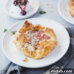 Golden Monte Cristo Puffs, with melty cheese and savory ham, a delicious party-friendly appetizer.