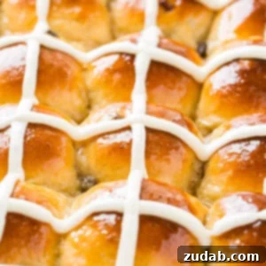 Delicious Hot Cross Buns, a classic Easter treat with a distinct cross on top, perfect for spring brunch.