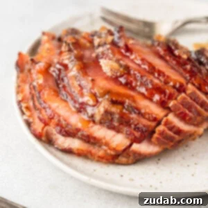 A beautifully glazed honey baked ham ready for serving, showcasing a classic Easter centerpiece.