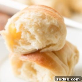 A basket of soft, golden potato rolls, warm and ready for the Easter dinner table.