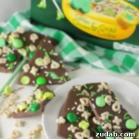 St Patrick's Day Delights Sweet to Savory 16 Delicious Lucky Charms bark, a no-bake holiday treat with melted chocolate and festive marshmallows.