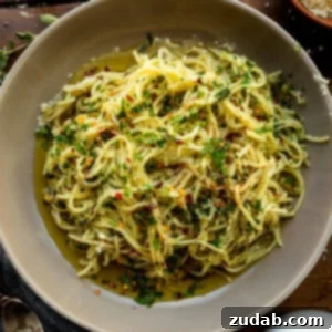 Hot sizzling Italian oil over fresh spaghetti, loaded with fresh herbs.
