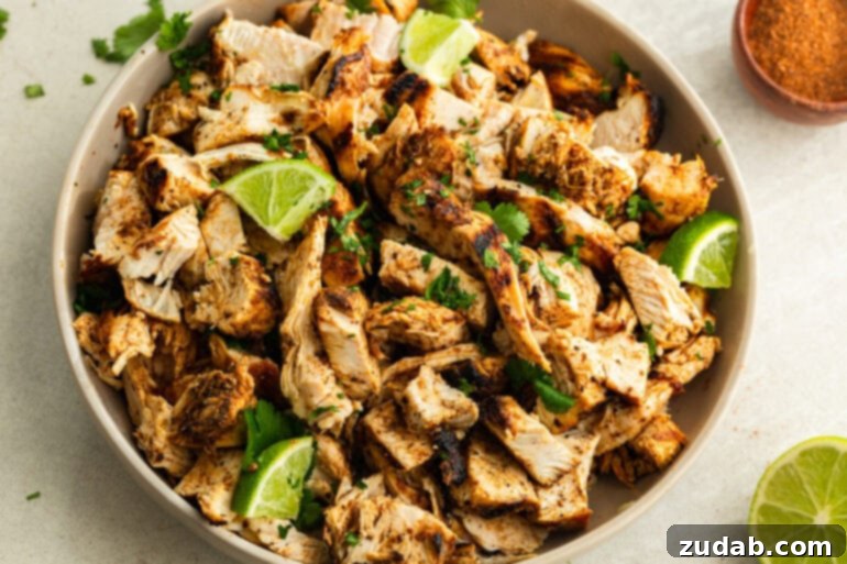Zesty Mexican Grilled Chicken 2 A photo of Mexican Grilled Chicken served in a beige bowl and topped with cilantro and lime