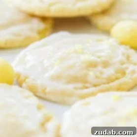 Soft and chewy lemon drop cookies are the perfect treat for those lemon lovers out there! A light glaze on top and a sprinkle of crushed lemon drops! ohsweetbasil.com