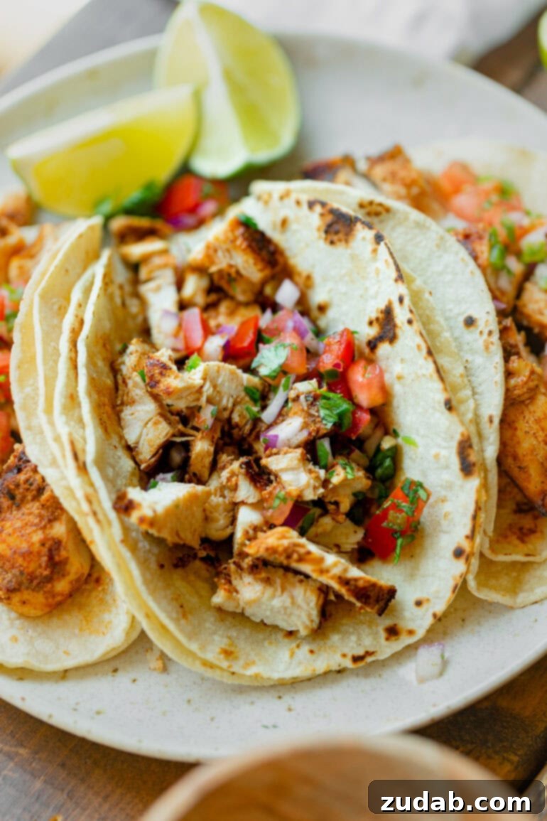 Easy Authentic Cinco de Mayo Recipes for Your Fiesta 4 a photo of a grilled chicken taco topped with fresh pico de gallo