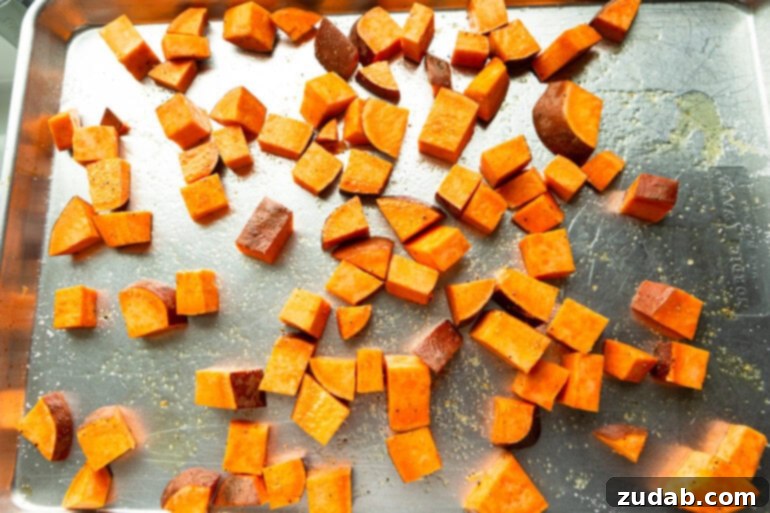 Street Corn Ground Beef Sweet Potato Power Bowl 4 A sheet pan loaded with perfectly cubed sweet potatoes, seasoned and ready for roasting until golden and tender.
